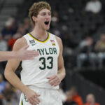 
              Baylor's Caleb Lohner (33) reacts after a play against UCLA during the first half of an NCAA college basketball game Sunday, Nov. 20, 2022, in Las Vegas. (AP Photo/John Locher)
            