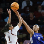 
              South Carolina guard Zia Cooke (1) shoots over Hampton guard Camryn Hill during the first quarter of an NCAA college basketball game in Columbia, S.C., Sunday, Nov. 27, 2022. (AP Photo/Nell Redmond)
            