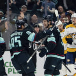
              Seattle Kraken defenseman Will Borgen, second from right, forward Andre Burakovsky, second from left, and forward Morgan Geekie celebrate a goal against the Nashville Predators during the first period of an NHL hockey game, Tuesday, Nov. 8, 2022, in Seattle. (AP Photo/Stephen Brashear)
            