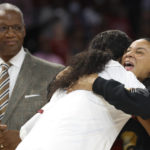 
              South Carolina head coach Dawn Staley, right, hugs a player as the 2022 South Carolina national championship team receive their rings before an an NCAA college basketball game in Columbia, S.C., Monday, Nov. 7, 2022. (AP Photo/Nell Redmond)
            