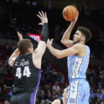 
              North Carolina forward Pete Nance, right, shoots over Portland center Joey St. Pierre during the first half of an NCAA college basketball game in the Phil Knight Invitational tournament in Portland, Ore., Thursday, Nov. 24, 2022. (AP Photo/Craig Mitchelldyer)
            