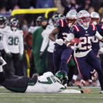 
              New England Patriots cornerback Marcus Jones (25) runs past New York Jets punter Braden Mann, left, on his punt return for a touchdown during the second half of an NFL football game, Sunday, Nov. 20, 2022, in Foxborough, Mass. The Patriots won 10-3.(AP Photo/Michael Dwyer)
            