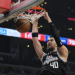 
              Los Angeles Clippers center Ivica Zubac (40) dunks against the Brooklyn Nets during the first half of an NBA basketball game Saturday, Nov. 12, 2022, in Los Angeles. (AP Photo/Marcio Jose Sanchez)
            
