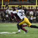 
              Iowa Hawkeyes defensive back Riley Moss (33) deflects a pass intended for Minnesota wide receiver Le'Meke Brockington (0) during the second half an NCAA college football game on Saturday, Nov. 19, 2022, in Minneapolis. The deflection resulted in an interception. (AP Photo/Craig Lassig)
            