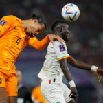 Virgil van Dijk of the Netherlands, left, and Senegal's Idrissa Gueye go for a header during the World Cup, group A soccer match between Senegal and Netherlands at the Al Thumama Stadium in Doha, Qatar, Monday, Nov. 21, 2022. (AP Photo/Petr David Josek)
