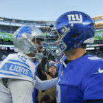 
              Detroit Lions quarterback Jared Goff (16) and New York Giants quarterback Daniel Jones (8) meet on the field after an NFL football game, Sunday, Nov. 20, 2022, in East Rutherford, N.J. (AP Photo/John Munson)
            