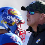 
              Kansas head coach Lance Leipold talks to his players during the first half of an NCAA college football game against Oklahoma State Saturday, Nov. 5, 2022, in Lawrence, Kan. (AP Photo/Charlie Riedel)
            