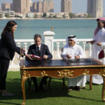 
              United States Secretary of State Antony Blinken, center left, and Qatar Foreign Minister Mohammed Bin Adbulrahman Al Thani, center right, sign a letter of intent during a media event at the Diplomatic Club, in Tuesday, Nov. 22, 2022. America's top diplomat criticized a decision by FIFA to threaten players at the World Cup with yellow cards if they wear armbands supporting inclusion and diversity. (AP Photo/Ashley Landis)
            