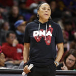 FILE - South Carolina head coach Dawn Staley watches her team during the second half of an NCAA college basketball exhibition game against Benedict in Columbia, S.C., Monday, Oct. 31, 2022. The Atlantic Coast and Southeastern conferences have led the way among the power conferences in hiring coaches of color to lead women's basketball programs. "There is an influx of Black women getting opportunities," South Carolina coach Dawn Staley said.(AP Photo/Nell Redmond, File)