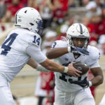 
              Penn State quarterback Sean Clifford (14) hands off the ball to running back Kaytron Allen (13) in the backfield during the first half of an NCAA college football game against Indiana, Saturday, Nov. 5, 2022, in Bloomington, Ind. (AP Photo/Doug McSchooler)
            