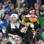 Football fans wearing pilgrim outfits are seen in the stands during the first half of an NFL football game between the Detroit Lions and the Buffalo Bills, Thursday, Nov. 24, 2022, in Detroit. (AP Photo/Paul Sancya)