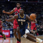 
              New Orleans Pelicans forward Zion Williamson (1) drives to the basket against Toronto Raptors forward Thaddeus Young in the first half of an NBA basketball game in New Orleans, Wednesday, Nov. 30, 2022. (AP Photo/Gerald Herbert)
            
