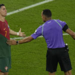 Portugal's Cristiano Ronaldo argues to Referee Ismail Elfath, of the United States, during the World Cup group H soccer match between Portugal and Ghana, at the Stadium 974 in Doha, Qatar, Thursday, Nov. 24, 2022. (AP Photo/Francisco Seco)