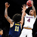 Arizona State's Desmond Cambridge Jr. (4) shoots over Michigan's Isaiah Barnes (11) during the first half of an NCAA college basketball game in the championship round of the Legends Classic Thursday, Nov. 17, 2022, in New York. (AP Photo/Frank Franklin II)