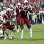 North Carolina State linebacker Drake Thomas (32) and linebacker Isaiah Moore (1) react after Thomas was called for pass interference when he broke up a pass for Boston College wide receiver Joseph Griffin Jr., left, in the final moment s of the second half of an NCAA college football game Saturday, Nov. 12, 2022, in Raleigh, N.C. Boston College scored on the ensuing drive. (AP Photo/Chris Seward)