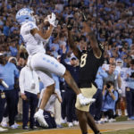 
              North Carolina wide receiver Antoine Green catches a touchdown pass against Wake Forest defensive back Isaiah Wingfield (8) during the first half of an NCAA college football game in Winston-Salem, N.C., Saturday, Nov. 12, 2022. (AP Photo/Chuck Burton)
            