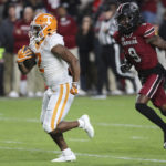 Tennessee running back Jabari Small (2) runs past South Carolina defensive back Cam Smith (9) for a touchdown during the first half of an NCAA college football game Saturday, Nov. 19, 2022, in Columbia, S.C. (AP Photo/Artie Walker Jr.)
