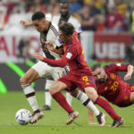 
              Spain's Gavi vies for the ball with Germany's Jamal Musiala, left, during the World Cup group E soccer match between Spain and Germany, at the Al Bayt Stadium in Al Khor , Qatar, Sunday, Nov. 27, 2022. (AP Photo/Matthias Schrader)
            