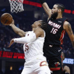 
              Cleveland Cavaliers forward Isaac Okoro (35) shoots against Miami Heat forward Caleb Martin (16) during the first half of an NBA basketball game, Sunday, Nov. 20, 2022, in Cleveland. (AP Photo/Ron Schwane)
            