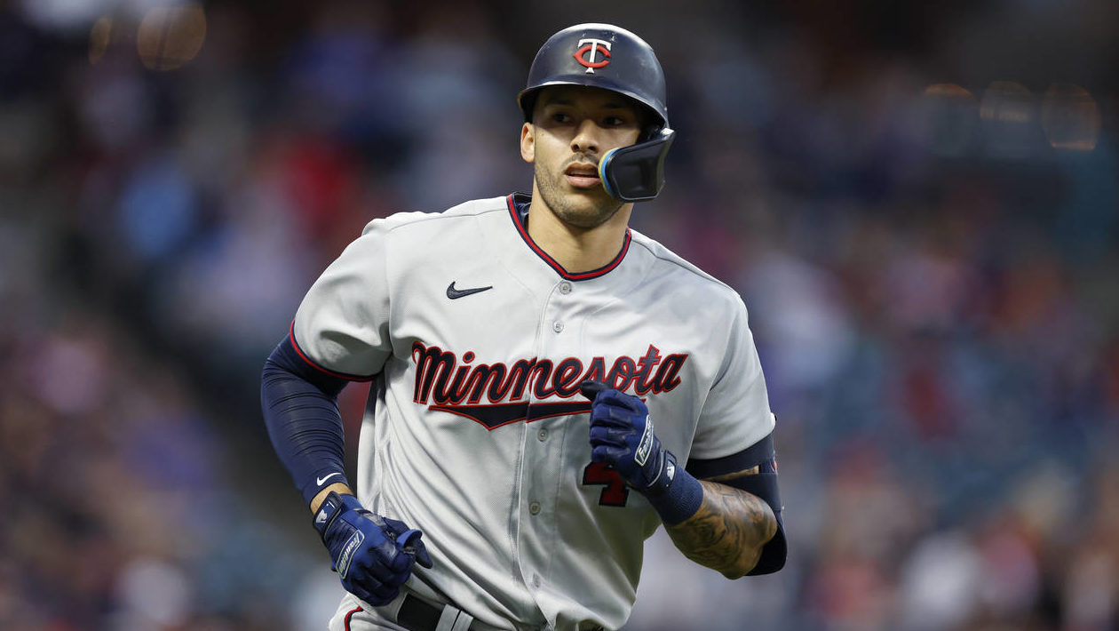 Minnesota Twins' Carlos Correa rounds the bases after hitting a two-run home run against the Clevel...