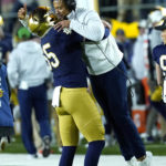 
              Notre Dame head coach Marcus Freeman is lifted in the air by defensive lineman Chris Smith during the second half of an NCAA college football game against Clemson Saturday, Nov. 5, 2022, in South Bend, Ind. Notre Dame won 35-14. (AP Photo/Charles Rex Arbogast)
            
