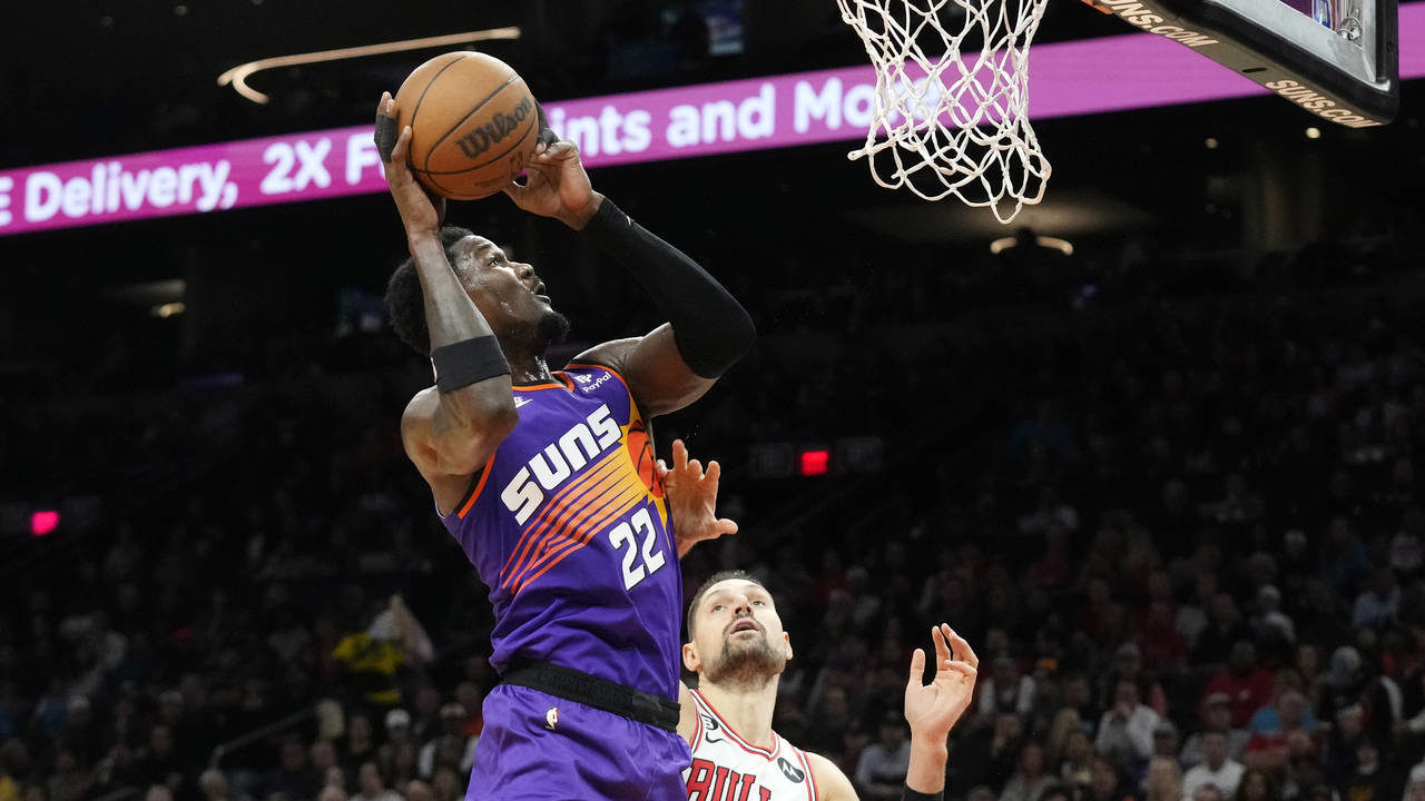Phoenix Suns center Deandre Ayton (22) shoots over Chicago Bulls center Nikola Vucevic (9) during t...