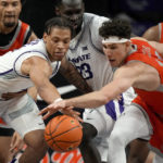 
              Kansas State forward Keyontae Johnson, left, and Texas-Rio Grande Valley forward Daylen Williams chase a loose ball during the first half of an NCAA college basketball game Monday, Nov. 7, 2022, in Manhattan, Kan. (AP Photo/Charlie Riedel)
            