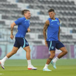 England Midfielder Kalvin Phillips, left, and defender Ben White take the field during England's official training on the eve of the group B World Cup soccer match between England and Iran, at Al Wakrah Sports Complex, in Al Wakrah, Qatar, Sunday, Nov. 20, 2022. (AP Photo/Abbie Parr)