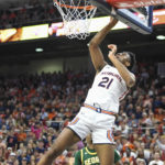
              Auburn forward Yohan Traore (21) scores two points during the first half of an NCAA college basketball game against George Mason, Monday, Nov. 7, 2022, in Auburn, Ala. (AP Photo/Julie Bennett)
            