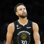 Golden State Warriors guard Stephen Curry (30) looks at the scoreboard during the second half of an NBA basketball game against the Phoenix Suns, Wednesday, Nov. 16, 2022, in Phoenix. (AP Photo/Matt York)