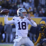 
              Kansas State quarterback Will Howard (18) passes against West Virginia during the first half of an NCAA college football game in Morgantown, W.Va., Saturday, Nov. 19, 2022. (AP Photo/Kathleen Batten)
            