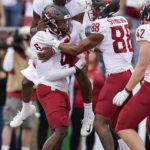 
              Washington State quarterback Cameron Ward (1) celebrates his passing touchdown to wide receiver Donovan Ollie (6) during the first half of an NCAA college football game against Stanford in Stanford, Calif., Saturday, Nov. 5, 2022. (AP Photo/Godofredo A. Vásquez)
            