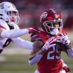 Utah wide receiver Jaylen Dixon (25) breaks free from Arizona safety Gunner Maldonado (9) on his way to a touchdown during the first half of an NCAA college football game Saturday, Nov. 5, 2022, in Salt Lake City. (AP Photo/Rick Bowmer)