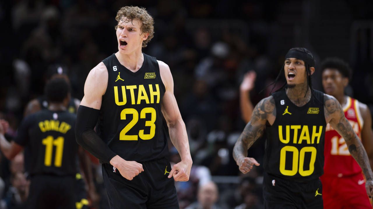 Utah Jazz's Lauri Markkanen left, and Jordan Clarkson right, react during the second half the team'...