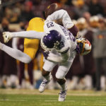 Minnesota wide receiver Dylan Wright (5) fumbles the ball after a hit by Northwestern defensive back Devin Turner (23) during the second half of an NCAA college football game Saturday, Nov. 12, 2022, in Minneapolis. (AP Photo/Abbie Parr)