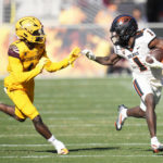 Oregon State wide receiver Tyjon Lindsey (1) runs with the ball as Arizona State defensive back Jordan Clark (1) closes in during the second half of an NCAA college football game in Tempe, Ariz., Saturday, Nov. 19, 2022. Oregon State won 31-7. (AP Photo/Ross D. Franklin)
