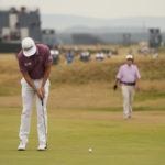 
              FILE - Cameron Smith, of Australia, putts on the 17th green during the final round of the British Open golf championship on the Old Course at St. Andrews, Scotland, Sunday July 17, 2022. His putt from 40 yards off the green with the Road Hole bunker in his way set up the crucial par putt for him to win the Open. (AP Photo/Gerald Herbert, File)
            