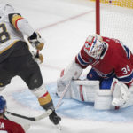 
              Montreal Canadiens goaltender Jake Allen stops Vegas Golden Knights' William Carrier (28) during the first period of an NHL hockey game Saturday, Nov. 5, 2022, in Montreal. (Graham Hughes/The Canadian Press via AP)
            