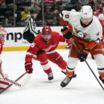 Anaheim Ducks left wing Pavol Regenda, right, controls the puck in front of Detroit Red Wings defenseman Jake Walman and goaltender Ville Husso (35) during the first period of an NHL hockey game Tuesday, Nov. 15, 2022, in Anaheim, Calif. (AP Photo/Marcio Jose Sanchez)