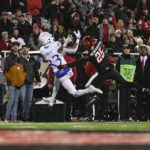 
              Kansas wide receiver Quentin Skinner (83) attempts to catch a pass while Texas Tech defensive back Dadrion Taylor-Demerson (25) defends during the first half of an NCAA college football game, Saturday, Nov. 12, 2022, in Lubbock, Texas. (AP Photo/Justin Rex)
            