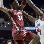
              Alabama forward Brandon Miller (24) works for a shot against South Alabama forward Tyler Shirley (24) during the first half of an NCAA college basketball game Tuesday, Nov. 15, 2022, in Mobile, Ala. (AP Photo/Vasha Hunt)
            