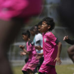 
              Youths warm up for training at the Independiente del Valle soccer club in Quito, Ecuador, Friday, Sept. 2, 2022. The club trains young men in soccer while providing them with up to a high school graduation and has become a key source for the country’s national soccer team. (AP Photo/Dolores Ochoa)
            