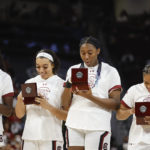 Members of the 2022 South Carolina national championship team receive their rings before an an NCAA college basketball game in Columbia, S.C., Monday, Nov. 7, 2022. (AP Photo/Nell Redmond)