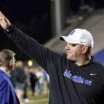 Duke head coach Mike Elko waves to fans as he walks off the field after earning a victory in Duke's final regular season NCAA college football game against Wake Forest in Durham, N.C., Saturday, Nov. 26, 2022. (AP Photo/Ben McKeown)