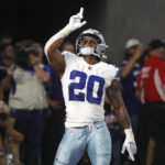 
              Dallas Cowboys running back Tony Pollard celebrates after catching a 30-yard touchdown pass during the first half of an NFL football game against the Minnesota Vikings, Sunday, Nov. 20, 2022, in Minneapolis. (AP Photo/Bruce Kluckhohn)
            
