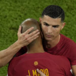 
              Portugal's Cristiano Ronaldo embraces team mate Joao Mario during his substitution at the World Cup group H soccer match between Portugal and Ghana, at the Stadium 974 in Doha, Qatar, Thursday, Nov. 24, 2022. (AP Photo/Francisco Seco)
            