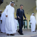 
              United States Secretary of State Antony Blinkin, right, and Qatar Foreign Minister Mohammed Bin Adbulrahman Al Thani, left, walk to a media event at the Diplomatic Club, in Tuesday, Nov. 22, 2022. America's top diplomat criticized a decision by FIFA to threaten players at the World Cup with yellow cards if they wear armbands supporting inclusion and diversity. (AP Photo/Ashley Landis)
            