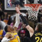 Los Angeles Lakers guard Russell Westbrook (0) shoots as Utah Jazz center Walker Kessler (24) defends during the first half of an NBA basketball game Monday, Nov. 7, 2022, in Salt Lake City. (AP Photo/Rick Bowmer)