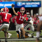 Georgia quarterback Stetson Bennett (13) throws from the pocket during the first half of an NCAA college football game against Tennessee, Saturday, Nov. 5, 2022 in Athens, Ga. (AP Photo/John Bazemore)