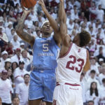 
              CORRECTS CITY TO BLOOMINGTON, INSTEAD OF INDIANAPOLIS - North Carolina forward Armando Bacot (5) shoots over Indiana forward Trayce Jackson-Davis (23) during the first half of an NCAA college basketball game in Bloomington, Ind., Wednesday, Nov. 30, 2022. (AP Photo/Darron Cummings)
            